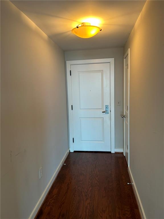 3338 Peachtree Road Northeast, Unit 2102 Atlanta, GA 30326 - Photo 3 of 14 an empty room with wooden floor and closet