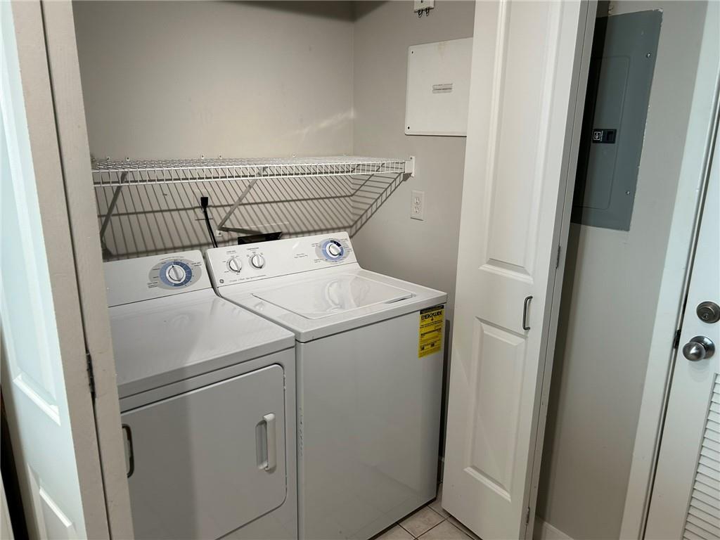 3338 Peachtree Road Northeast, Unit 2102 Atlanta, GA 30326 - Photo 6 of 14 a utility room with dryer and washer