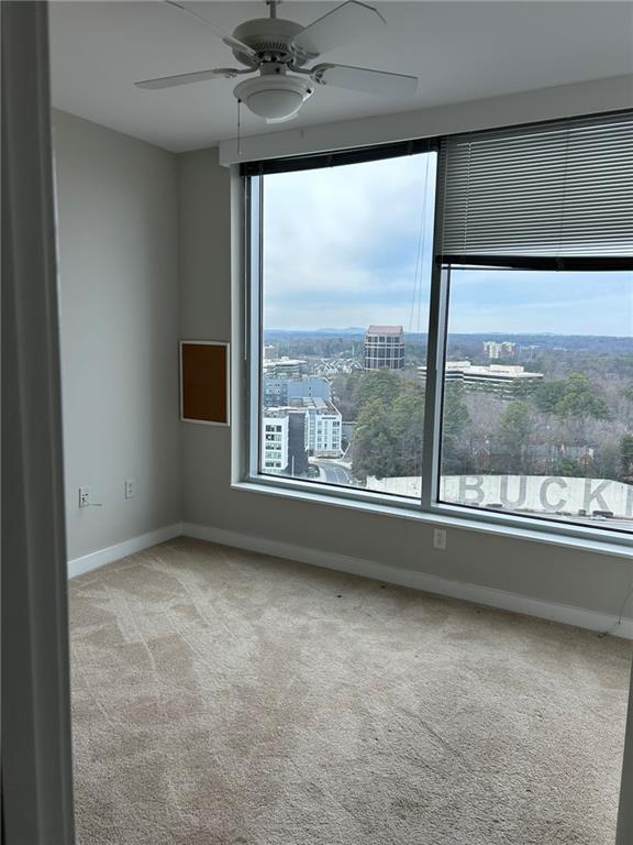 3338 Peachtree Road Northeast, Unit 2102 Atlanta, GA 30326 - Photo 8 of 14 an empty room with a window