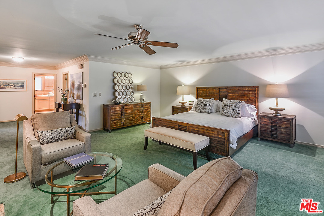 10 Gale Place Santa Monica, CA 90402 - Photo 37 of 46 a bedroom with furniture and a chandelier