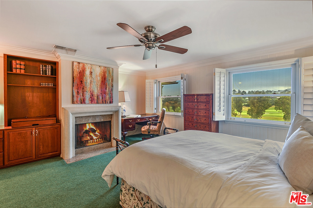 10 Gale Place Santa Monica, CA 90402 - Photo 41 of 46 a bedroom with furniture and a fireplace