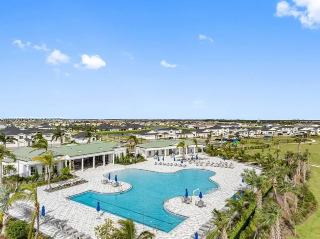 a view of a swimming pool with a patio