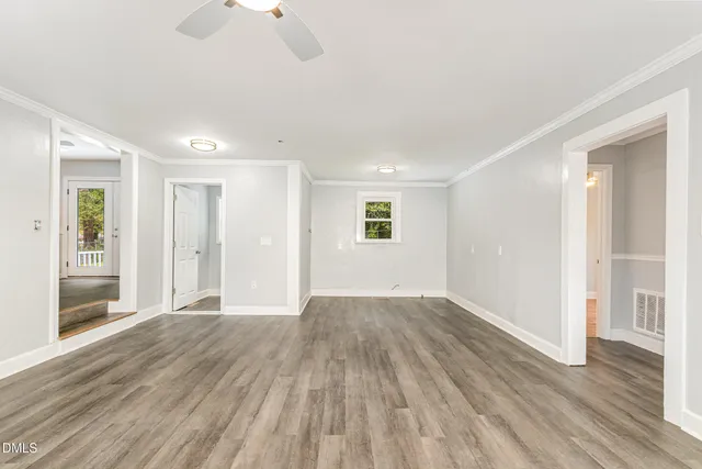 a picture of a bench in front of a wall