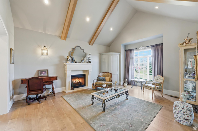 930 Price Farm Court Midway, UT 84049 - Photo 13 of 42 Living area featuring quarter sawn white oak flooring, vaulted ceiling, and fireplace