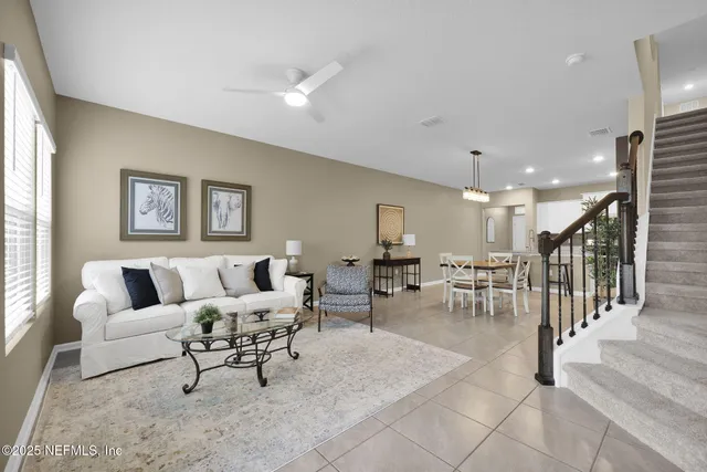a living room with furniture and a table