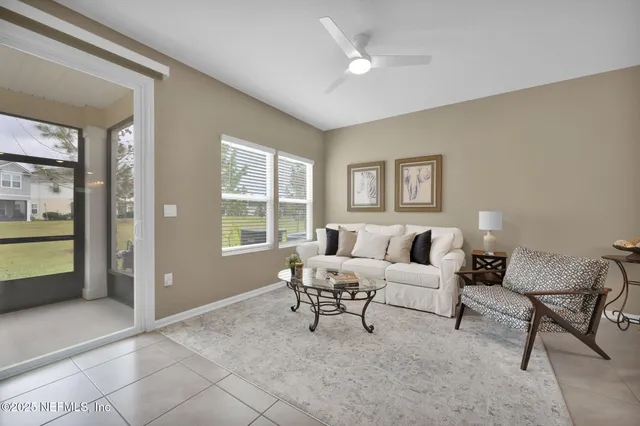 a living room with furniture and a window