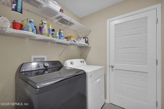 a utility room with dryer and washer