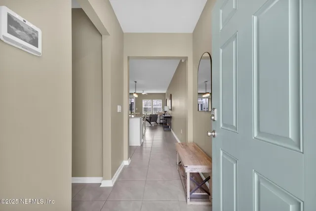 a view of a hallway view with living room and with furniture