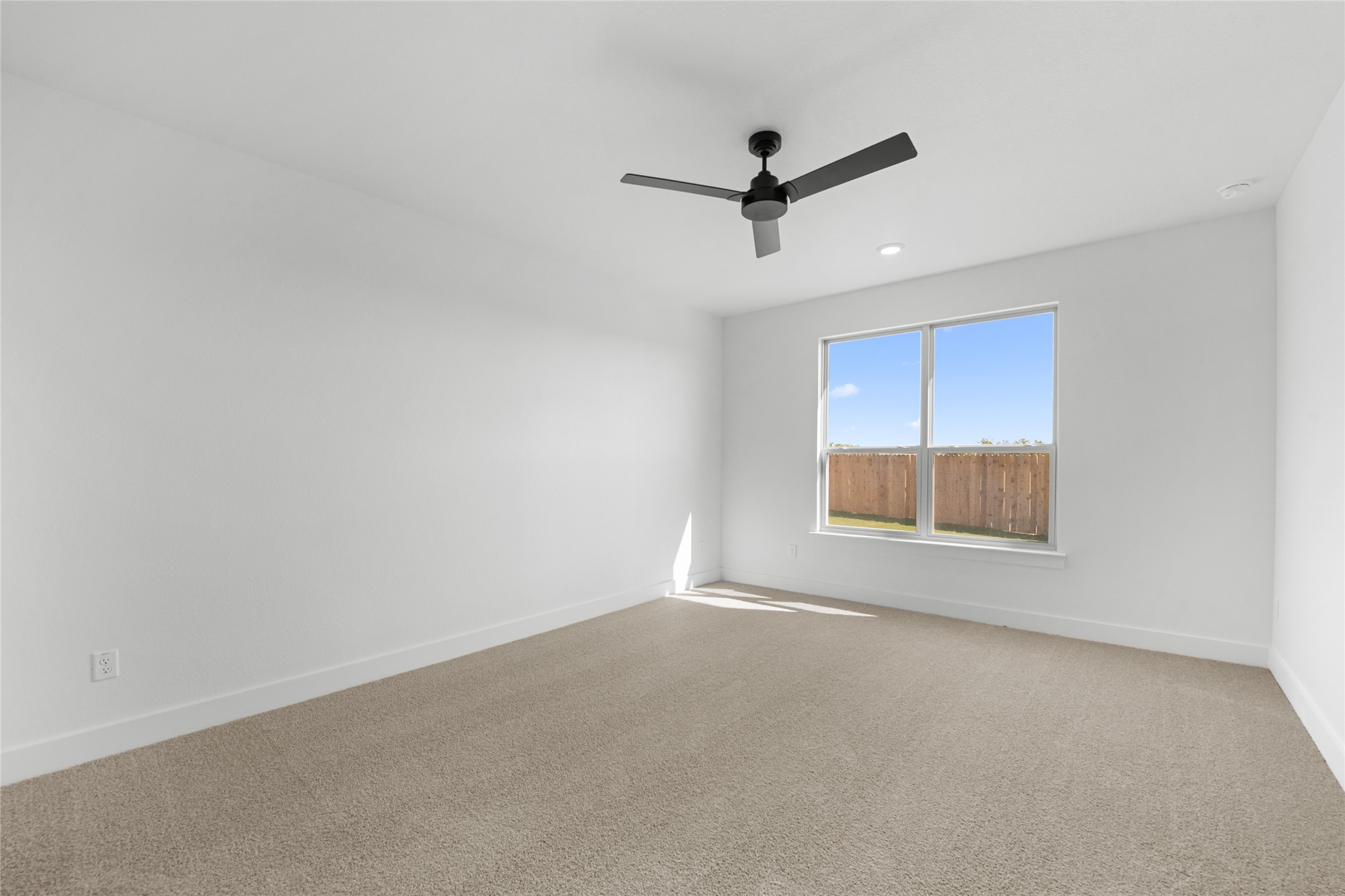 560 Gus Loop Georgetown, TX 78626 - Photo 7 of 17 an empty room with a empty space and windows