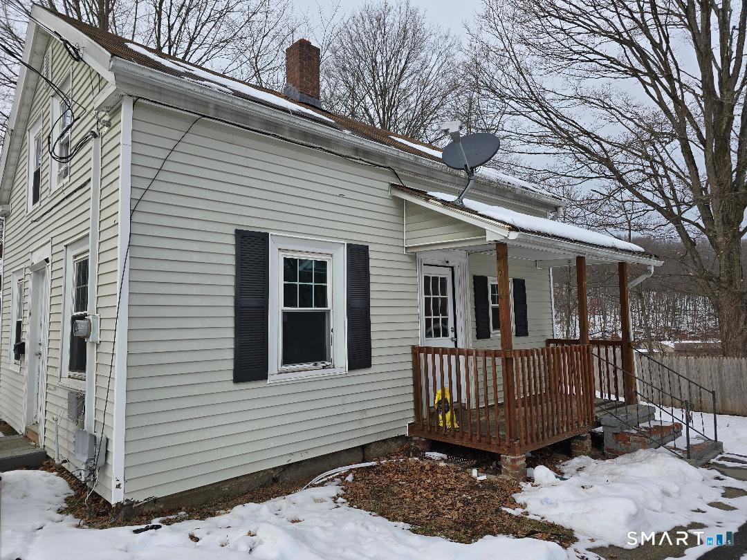 116 Rosette Street Waterbury, CT 06708 - Photo 1 of 7 a view of a house with a roof deck