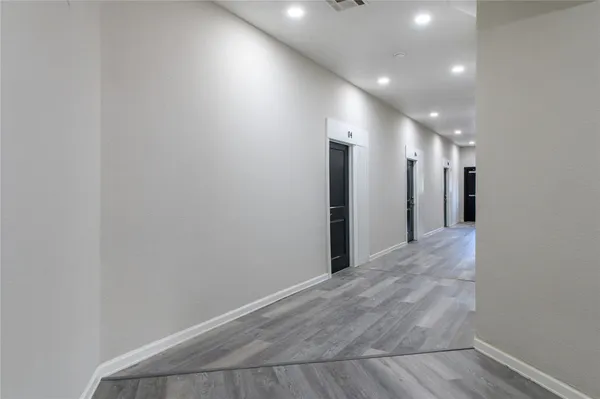 a view of hallway with a large window