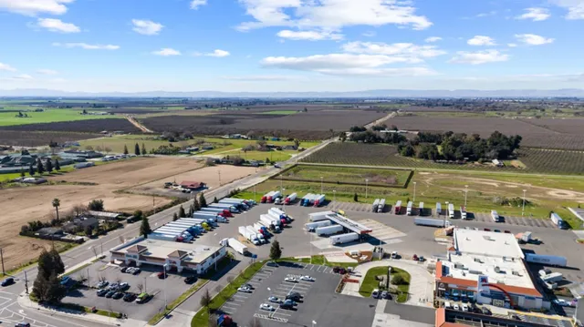 a view of a street with a building in the background