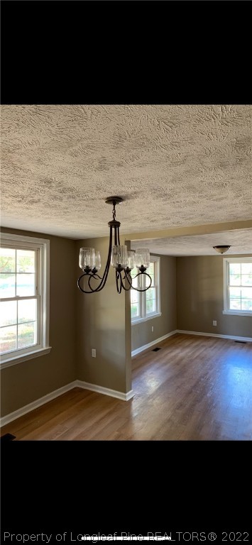 1215-1219 Camden Road Fayetteville, NC 28306 - Photo 11 of 25 a view of empty room with windows