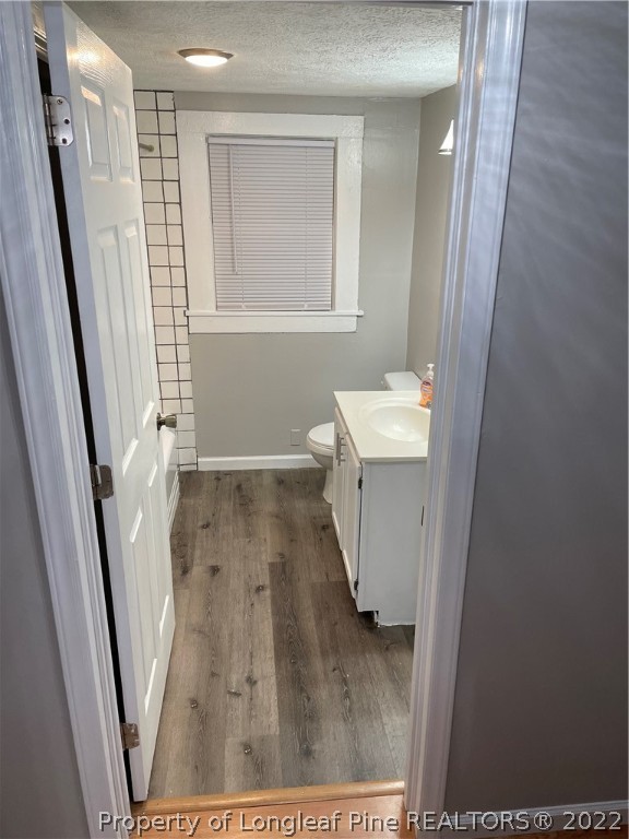 1215-1219 Camden Road Fayetteville, NC 28306 - Photo 13 of 25 a view of a room with wooden floor and staircase