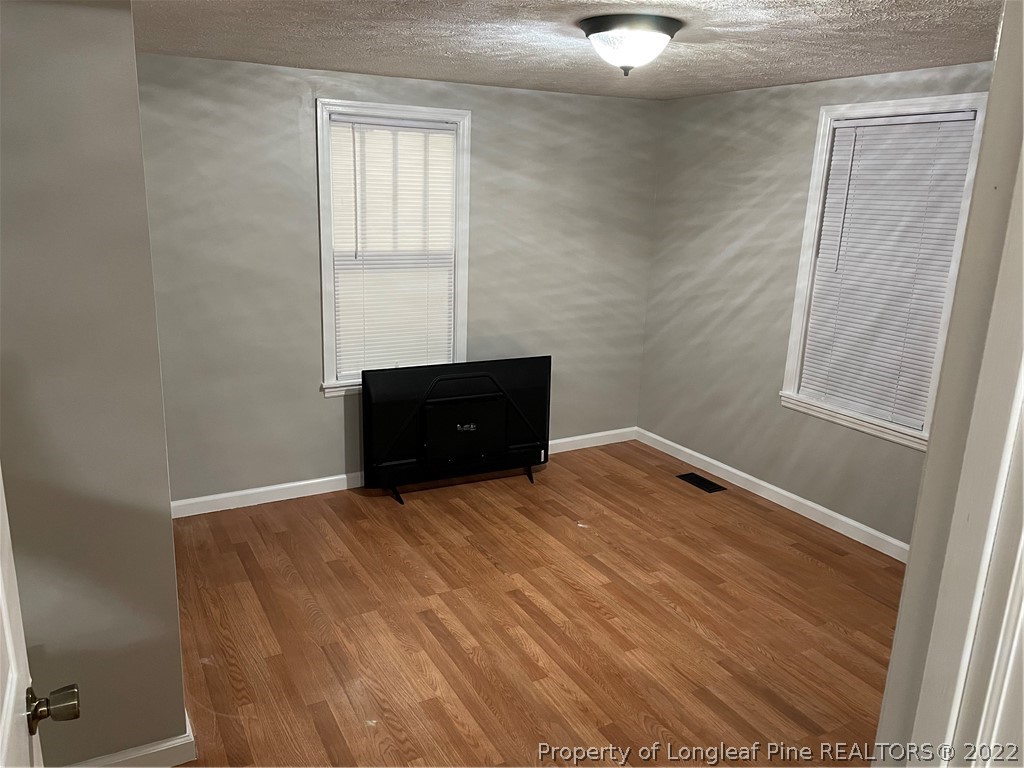 1215-1219 Camden Road Fayetteville, NC 28306 - Photo 19 of 25 a room with a bed
