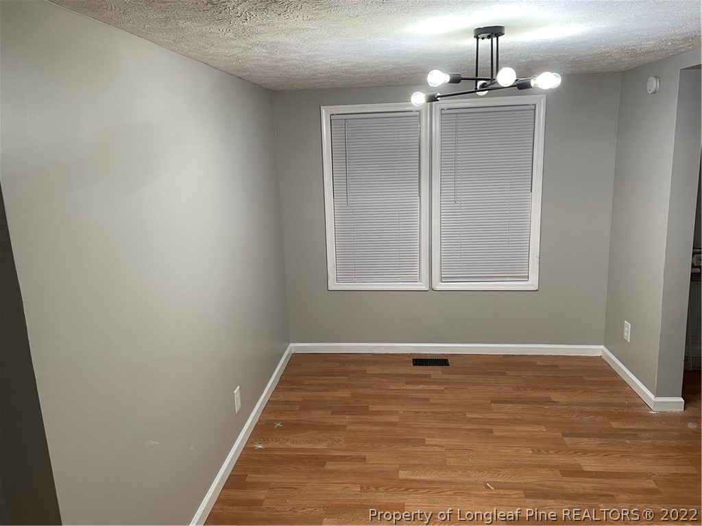 1215-1219 Camden Road Fayetteville, NC 28306 - Photo 21 of 25 a view of a room with wooden floor