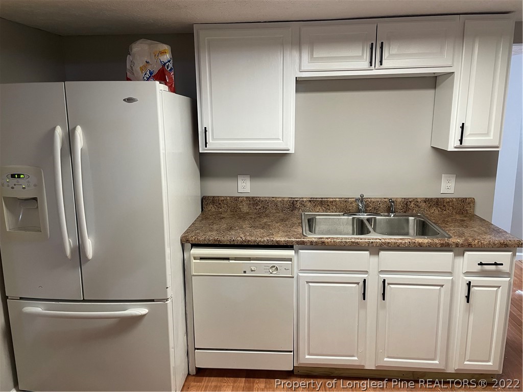 1215-1219 Camden Road Fayetteville, NC 28306 - Photo 22 of 25 a white refrigerator freezer sitting inside of a kitchen