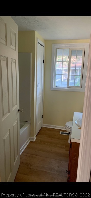 1215-1219 Camden Road Fayetteville, NC 28306 - Photo 10 of 25 a view of empty room with wooden floor
