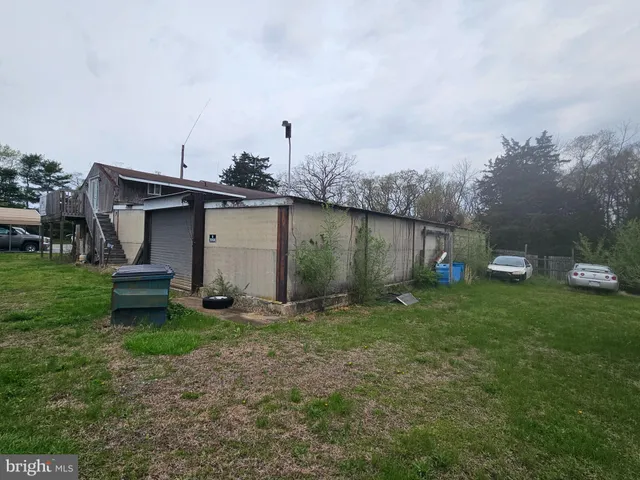 a view of a field of grass and trees
