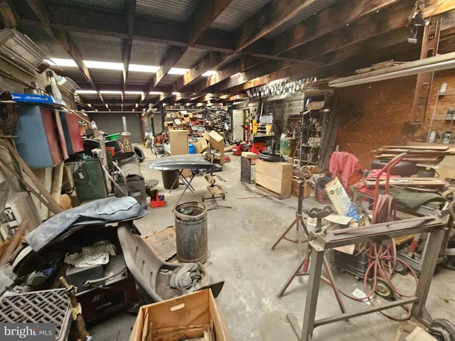 an aerial view of a house with backyard space and sitting area