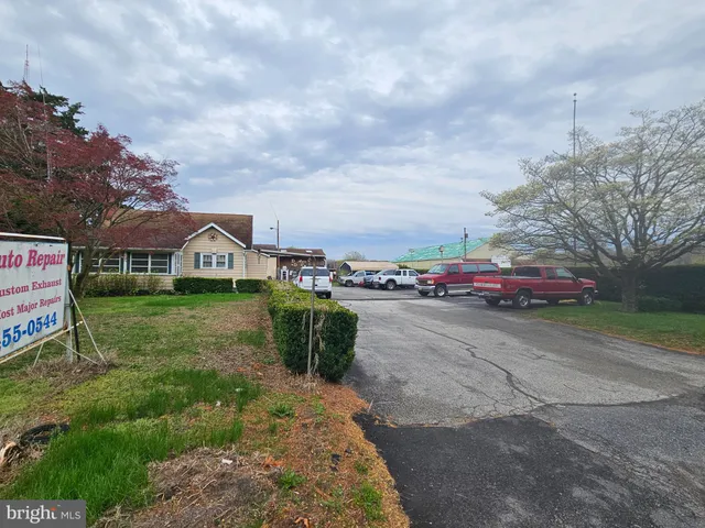 a front view of a house with parking space