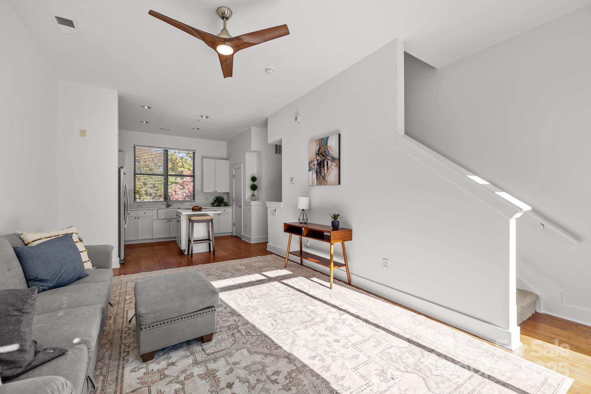 927 East 8th Street Charlotte, NC 28204 - Photo 12 of 35 a living room with furniture and a window