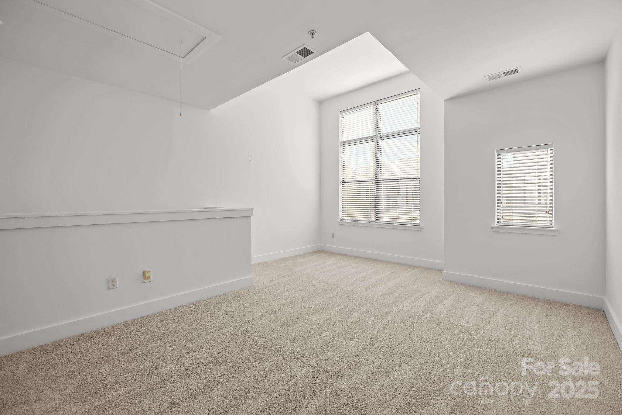 927 East 8th Street Charlotte, NC 28204 - Photo 17 of 35 an empty room with windows