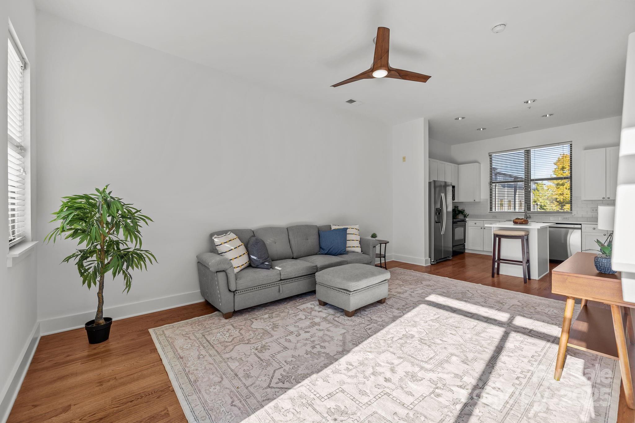 927 East 8th Street Charlotte, NC 28204 - Photo 10 of 35 a living room with furniture and a potted plant