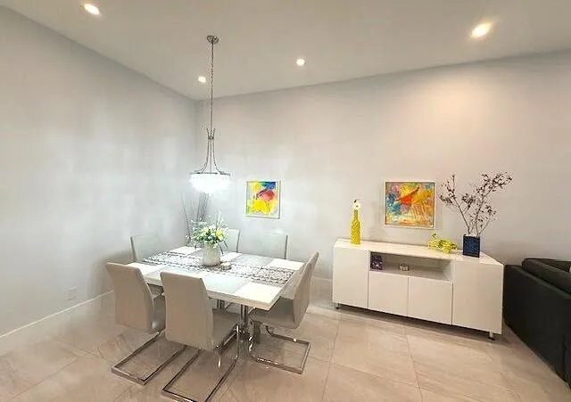 a view of a dining room with furniture and window