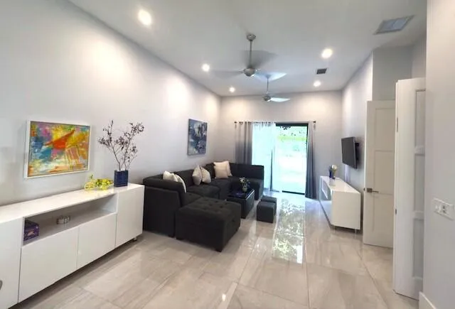 a living room with furniture and a flat screen tv