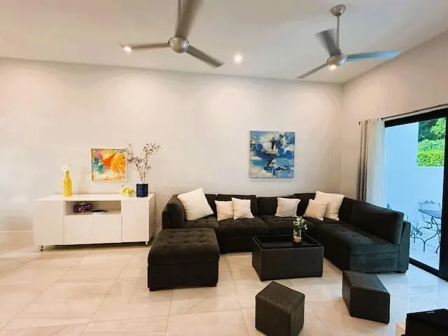 a living room with furniture and a table