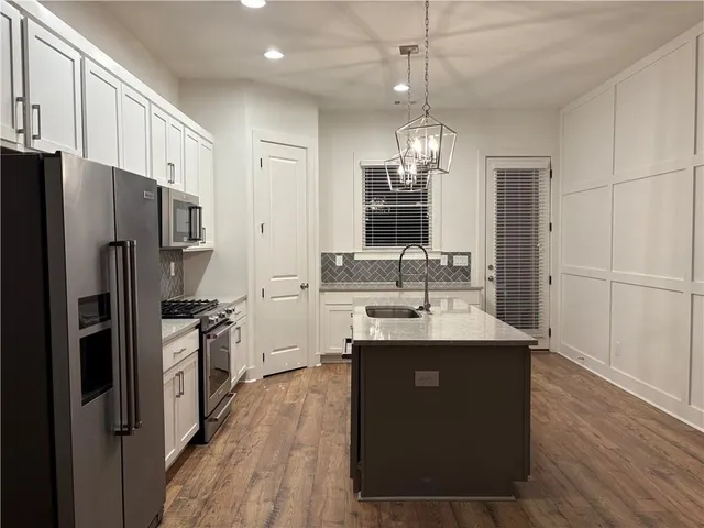 a view of a livingroom with a fireplace and wooden floor
