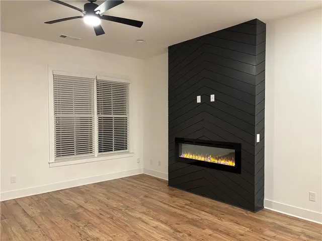 an empty room with wooden floor