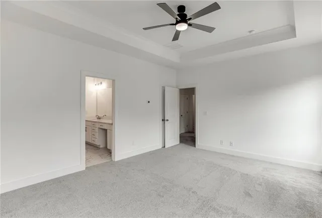 a spacious bathroom with a shower and a sink