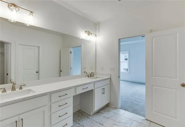 a bathroom with a sink toilet vanity and bathtub