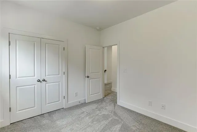 a view of a house with a small yard