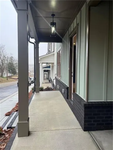 a front view of a building with street sign