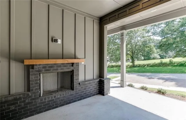 a view of an empty room with a kitchen