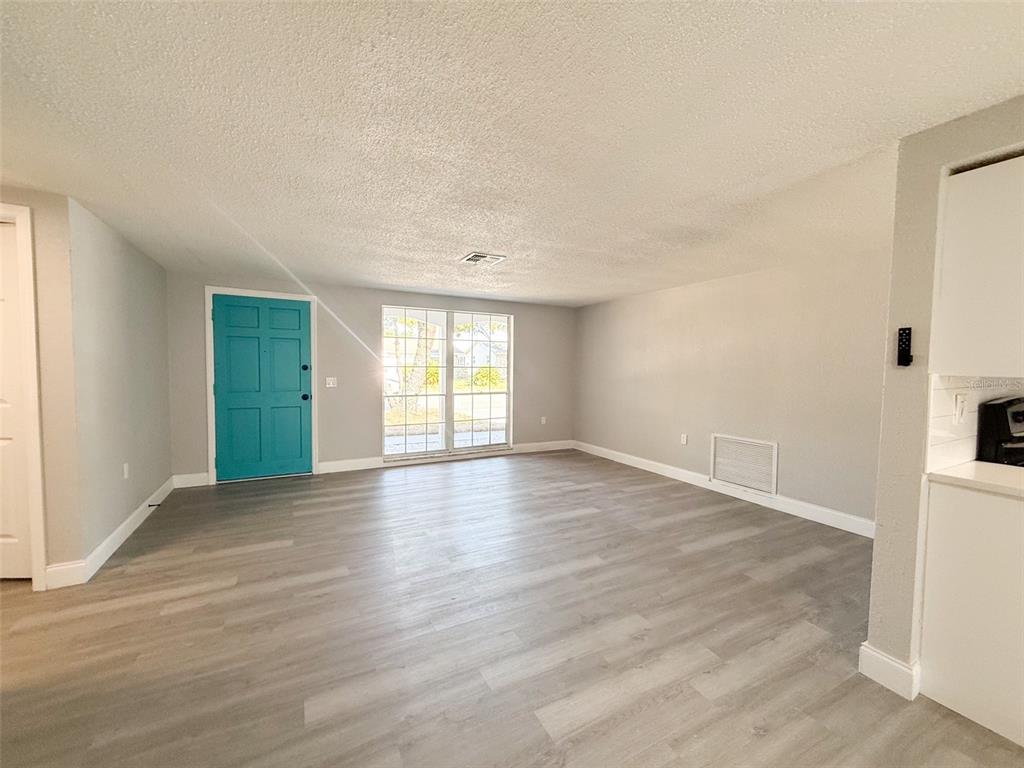 6834 Amarillo Street Port Richey, FL 34668 - Photo 5 of 31 From the dinette area looking at the living room.