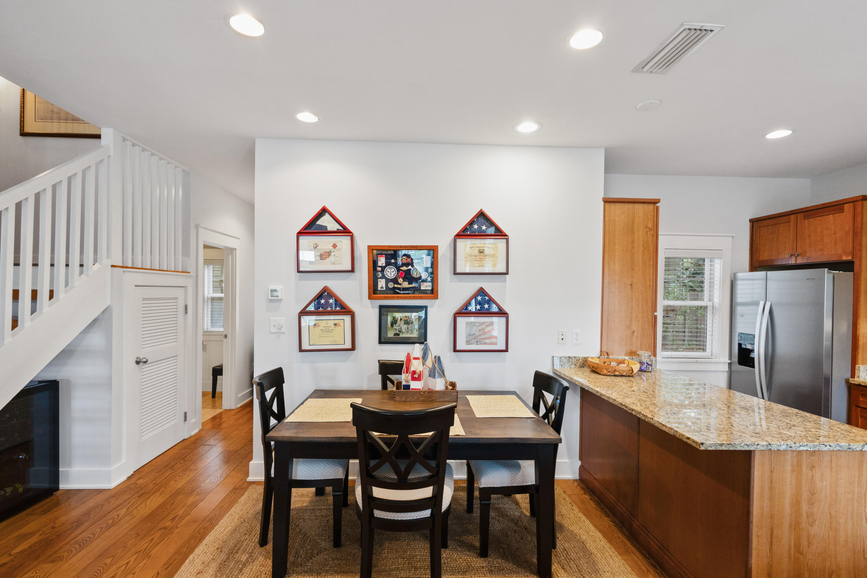 58 South Summit Drive Santa Rosa Beach, FL 32459 - Photo 14 of 40 a view of kitchen with stainless steel appliances granite countertop a dining table and chairs with wooden floor