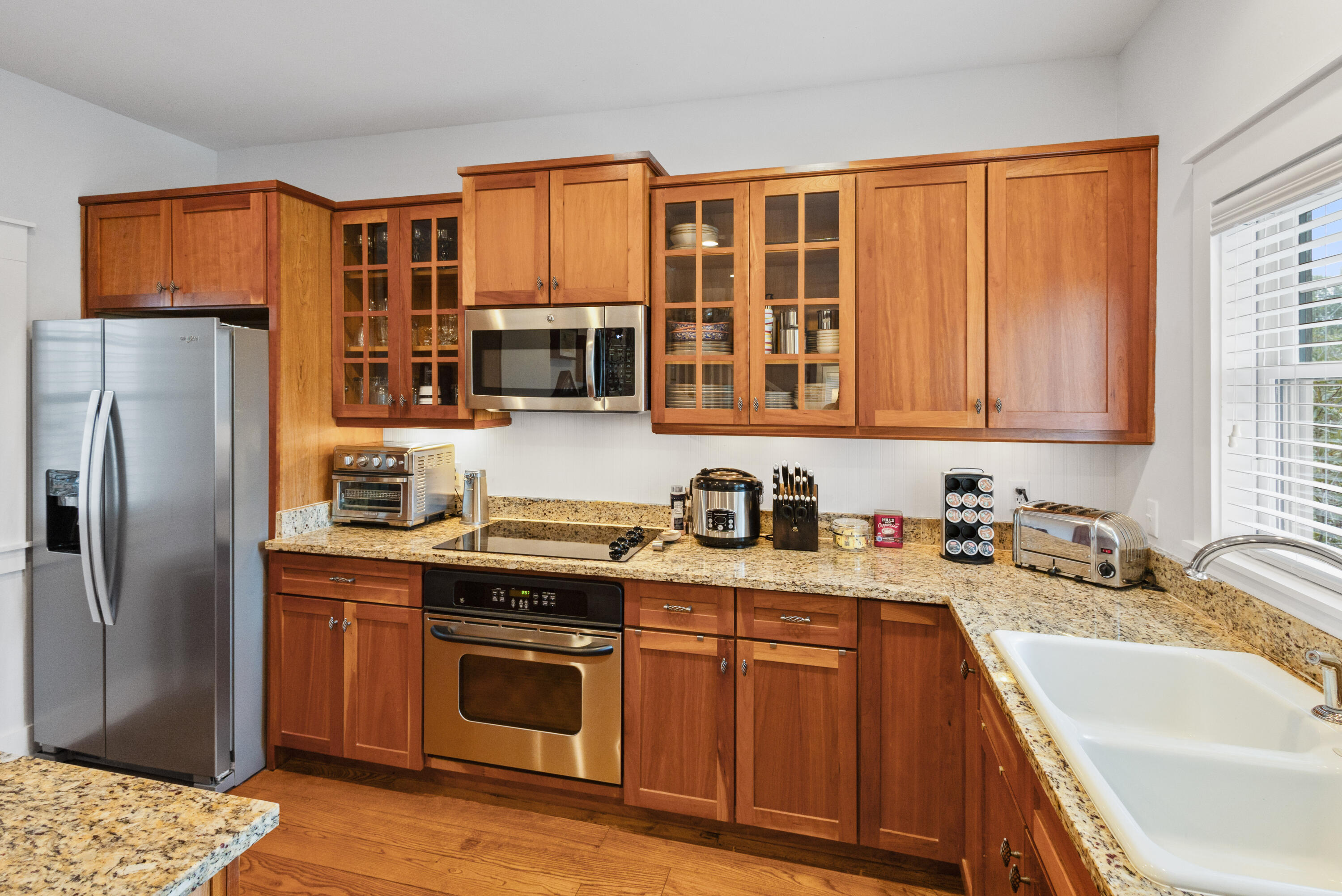 58 South Summit Drive Santa Rosa Beach, FL 32459 - Photo 15 of 40 a kitchen with stainless steel appliances granite countertop a sink stove and refrigerator