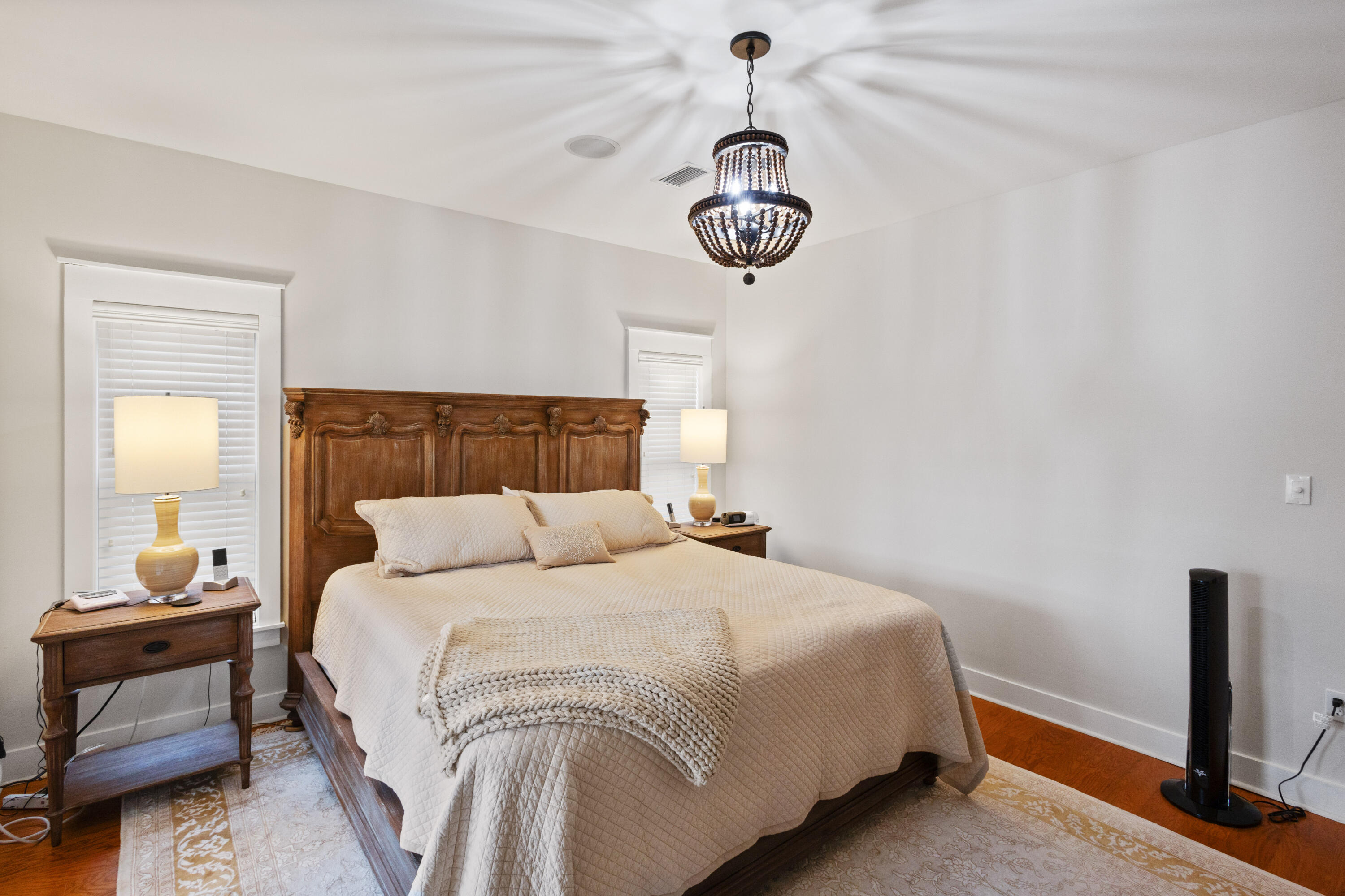 58 South Summit Drive Santa Rosa Beach, FL 32459 - Photo 20 of 40 a bedroom with a bed and a chandelier