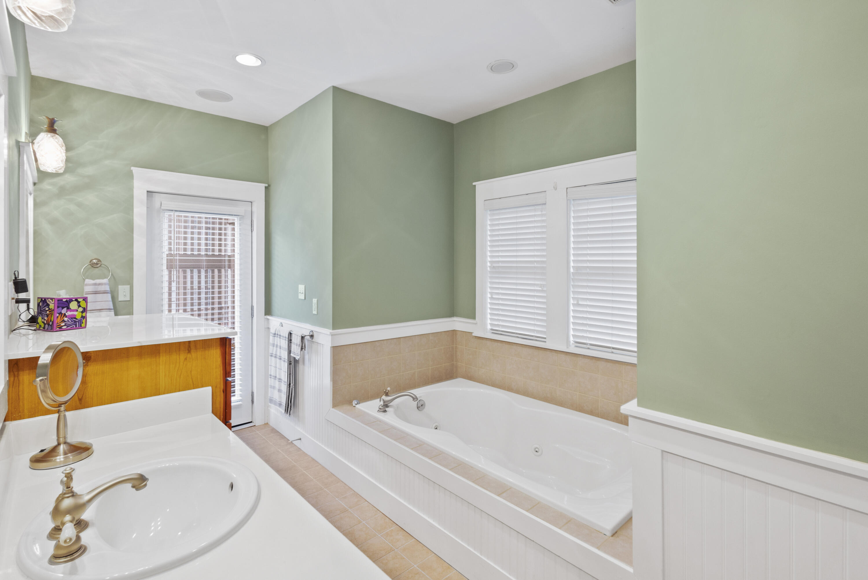 58 South Summit Drive Santa Rosa Beach, FL 32459 - Photo 22 of 40 a bathroom with a tub sink and mirror