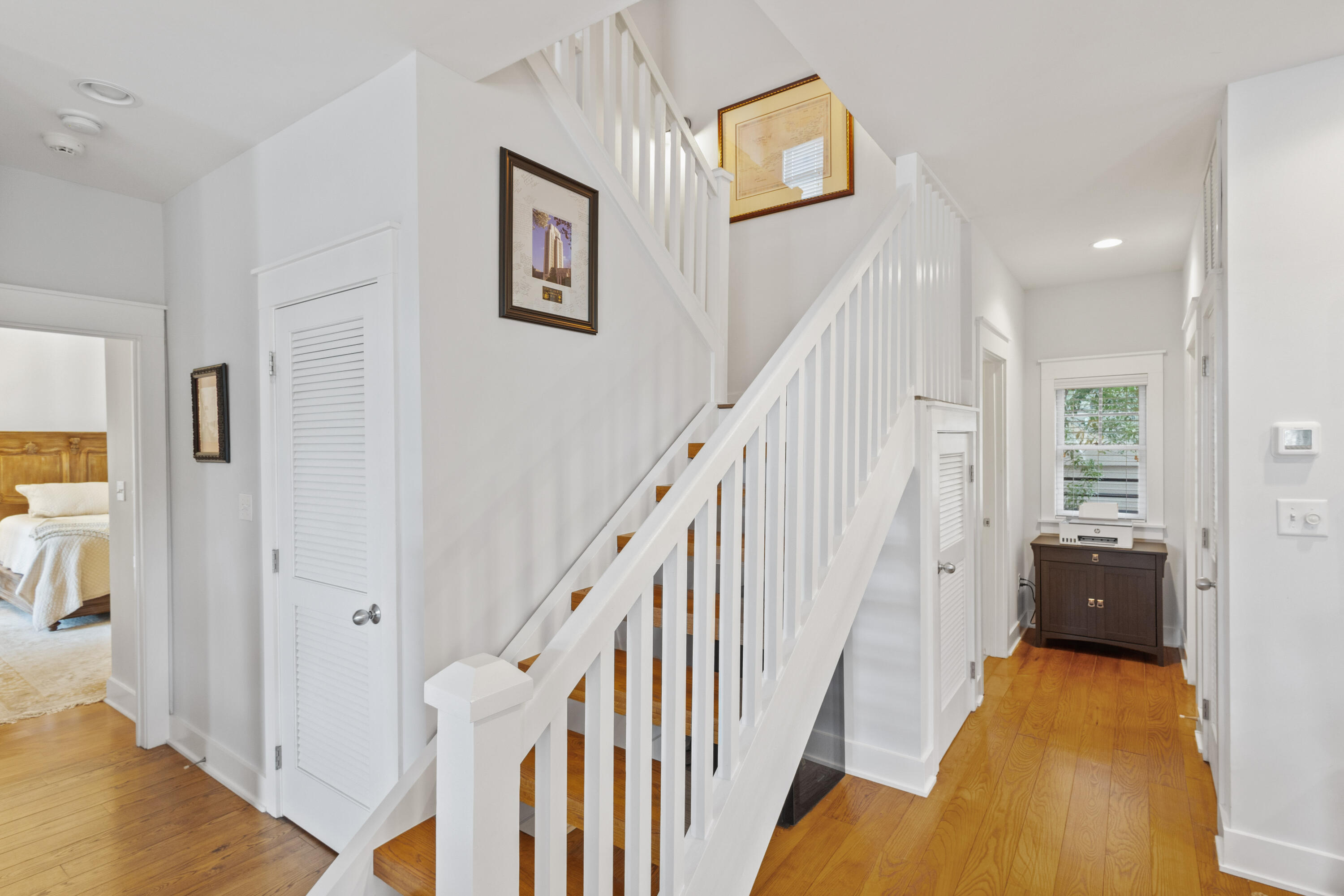 58 South Summit Drive Santa Rosa Beach, FL 32459 - Photo 25 of 40 a view of a livingroom with wooden floor and stairs