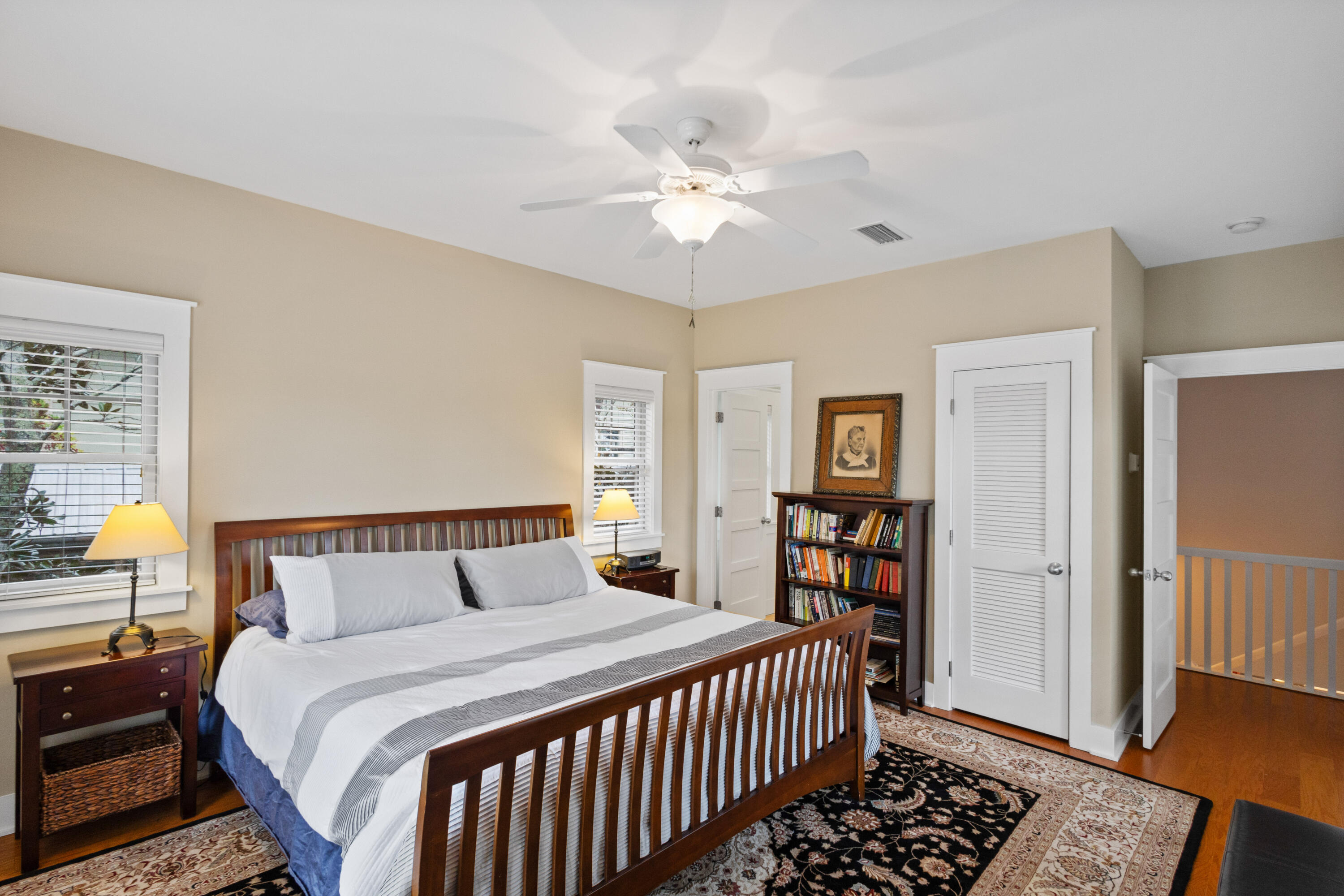 58 South Summit Drive Santa Rosa Beach, FL 32459 - Photo 27 of 40 a bedroom with a large bed and a chandelier