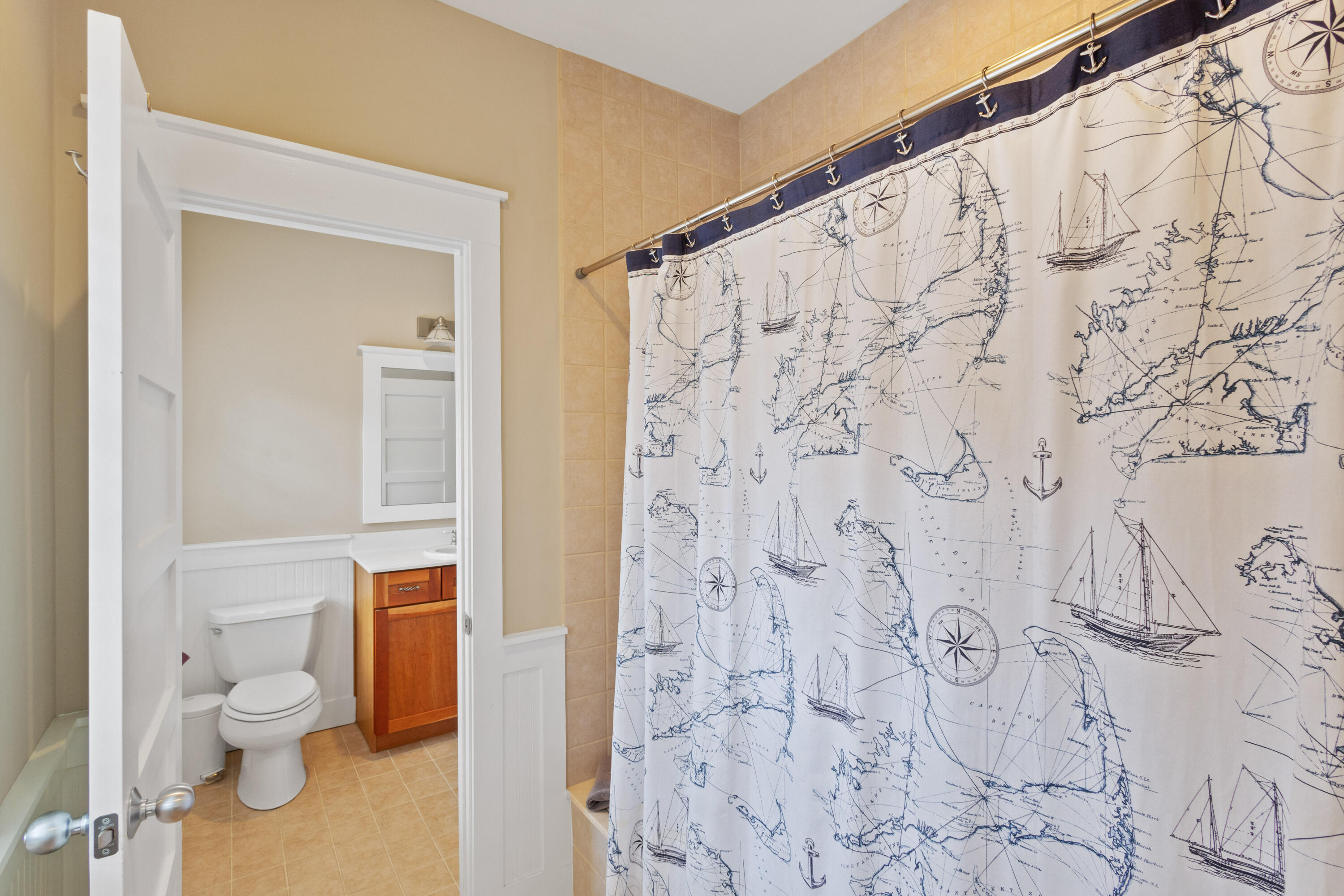 58 South Summit Drive Santa Rosa Beach, FL 32459 - Photo 29 of 40 a bathroom with a toilet and shower curtain