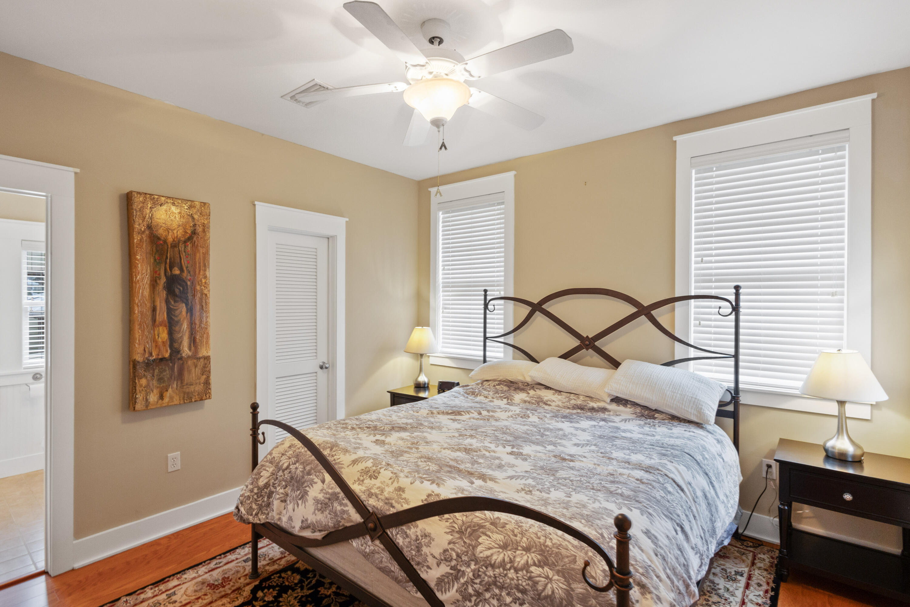 58 South Summit Drive Santa Rosa Beach, FL 32459 - Photo 30 of 40 a bedroom with a bed and a chandelier