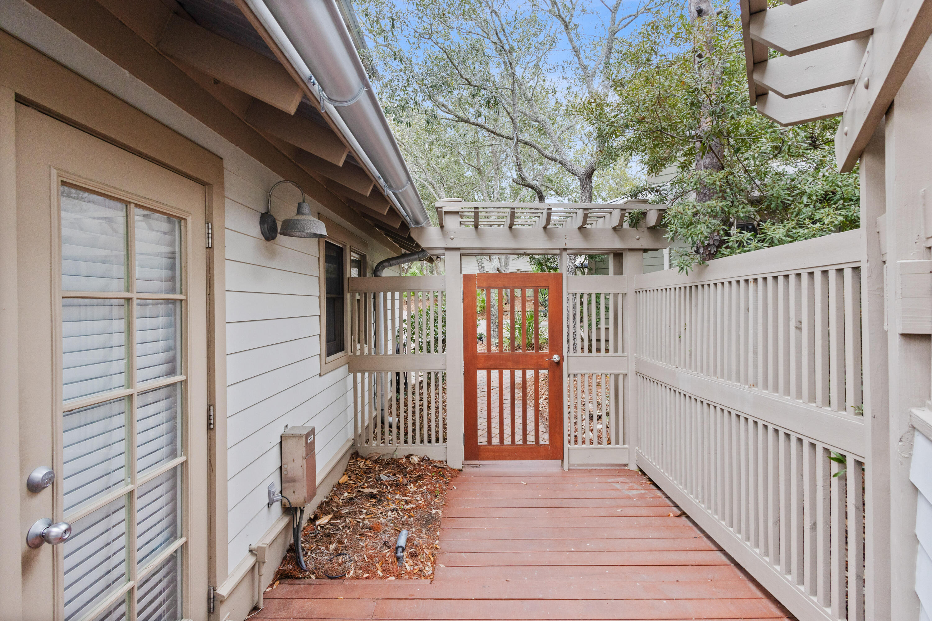 58 South Summit Drive Santa Rosa Beach, FL 32459 - Photo 33 of 40 a view of a porch with wooden floor and stairs