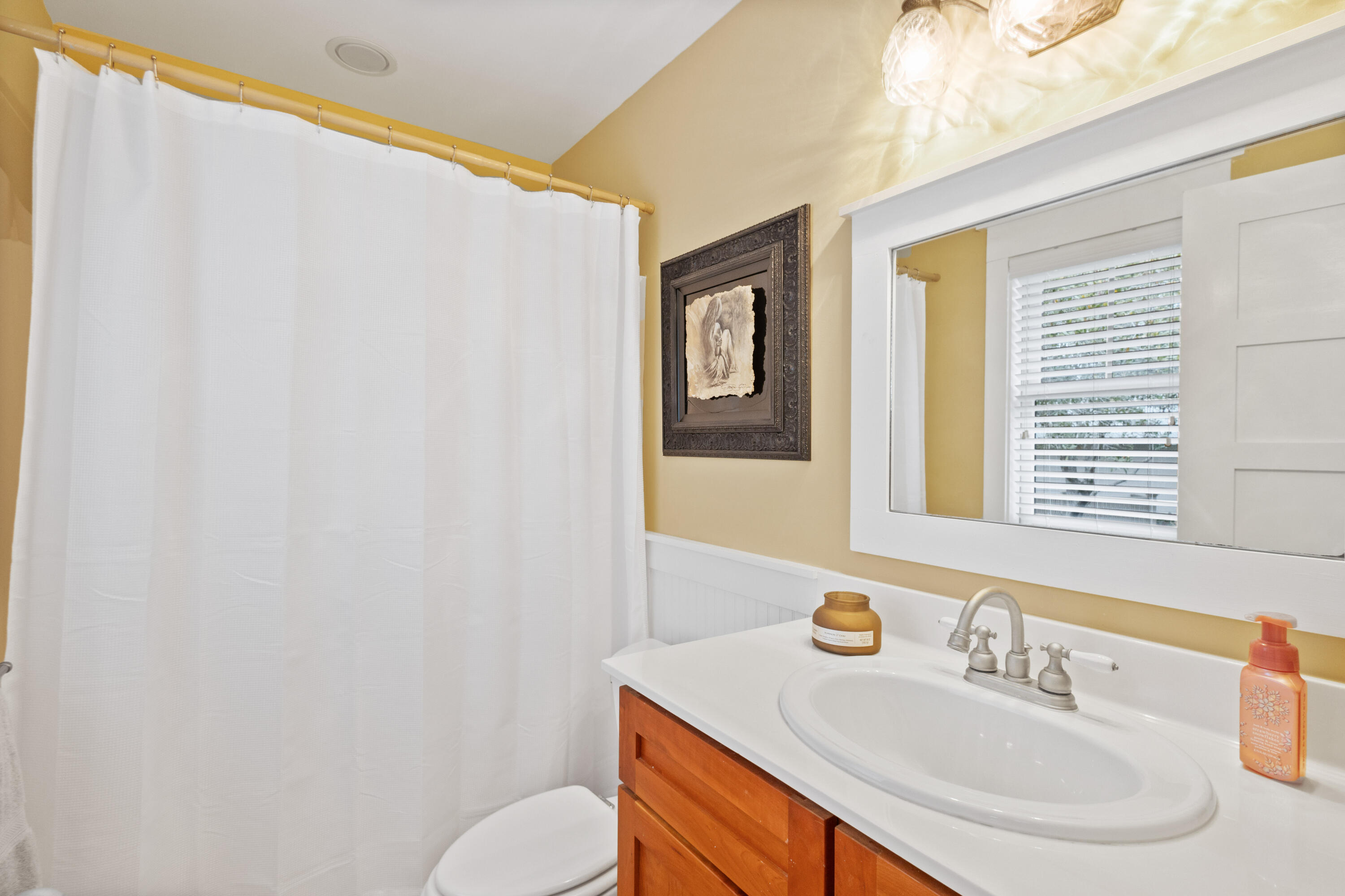 58 South Summit Drive Santa Rosa Beach, FL 32459 - Photo 37 of 40 a bathroom with a sink and a mirror