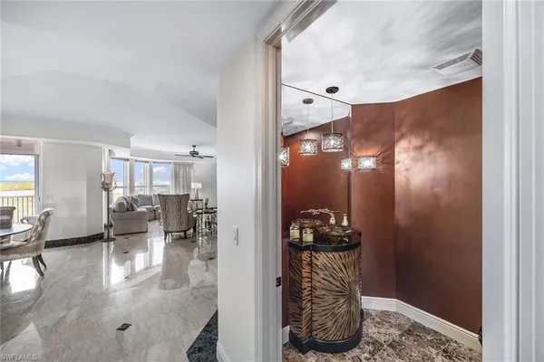 a dining room with furniture and wooden floor